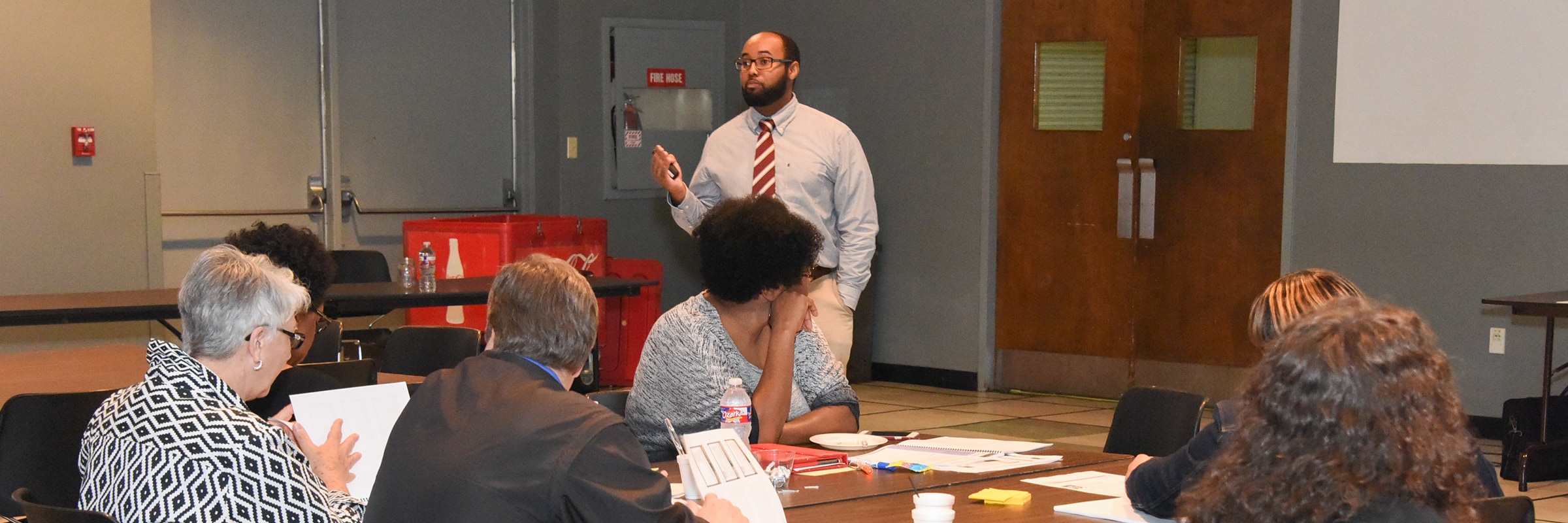 Terence Norwood of GCD presents in front of an audience in the Bost Theater.